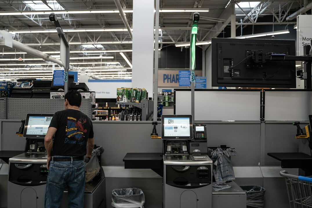 supermarket employee at checkout